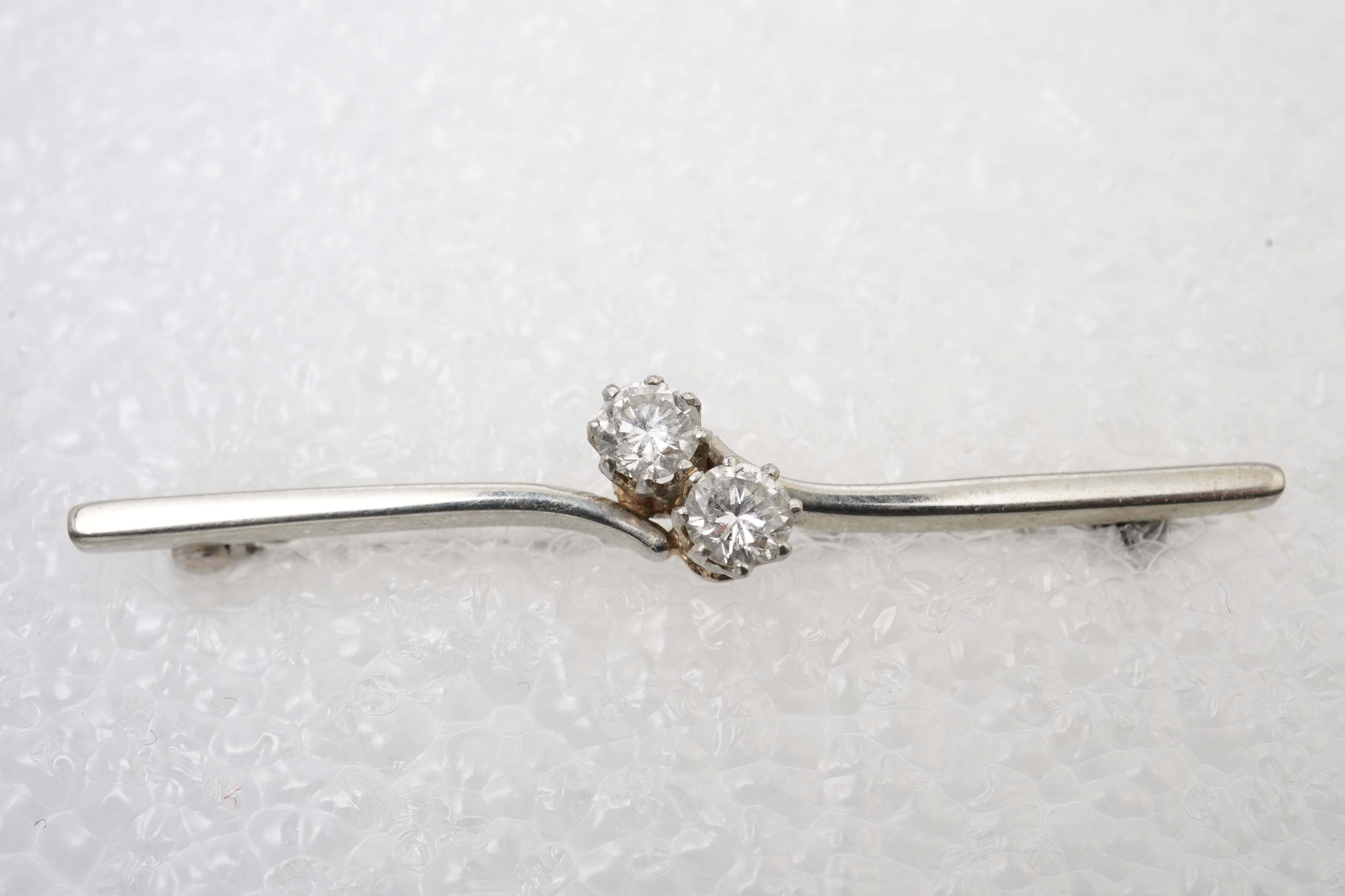 A diamond bar brooch